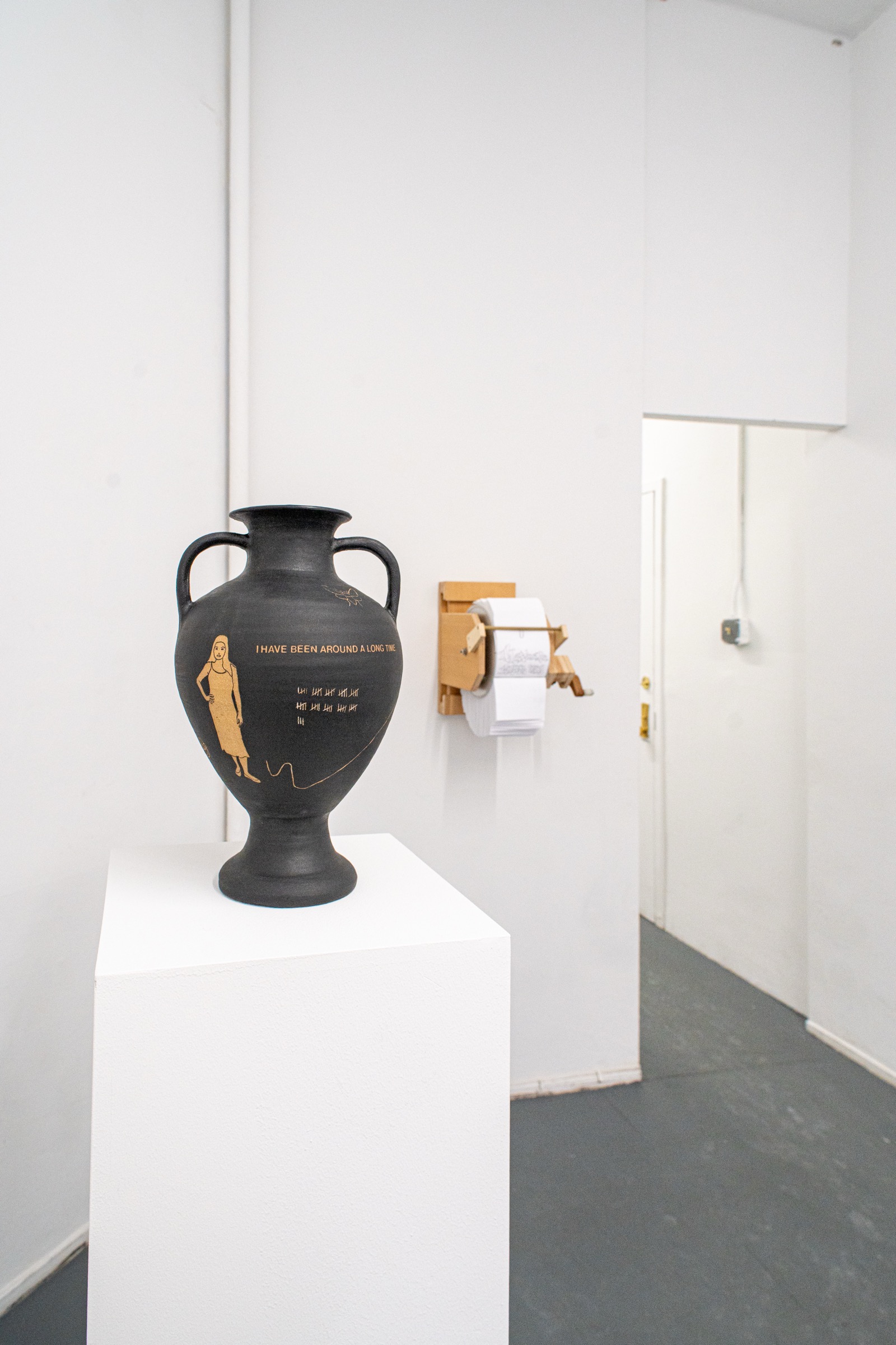 Black ceramic vessel displayed in the Expired exhibition